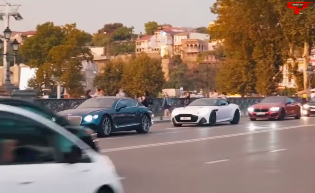 The trio drives across Metekhi Bridge in Tbilisi, Georgia. Credit: The Grand Tour Fans